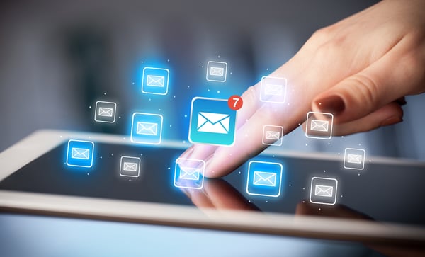 Female hands touching tablet with e-mail icons